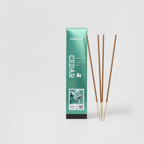 Cedar incense packaging with three incense sticks on a white background